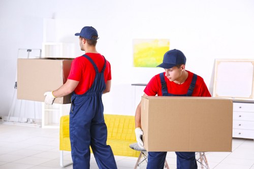Removal van and moving team outside a Balham residential street