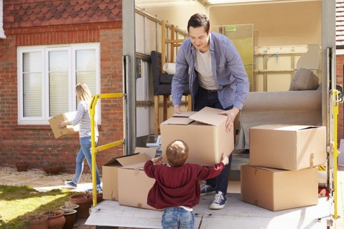 Boxes and furniture loaded into a moving van for urgent removals