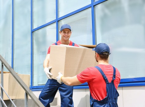 Boxes and household items being loaded into a removals van