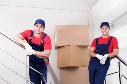 Furniture and boxes being loaded into a moving van