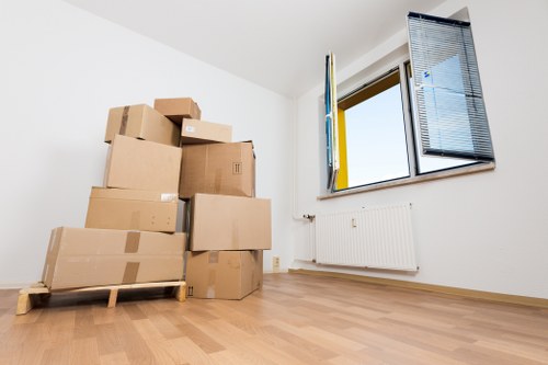 New homeowners unloading boxes after house removals in Balham