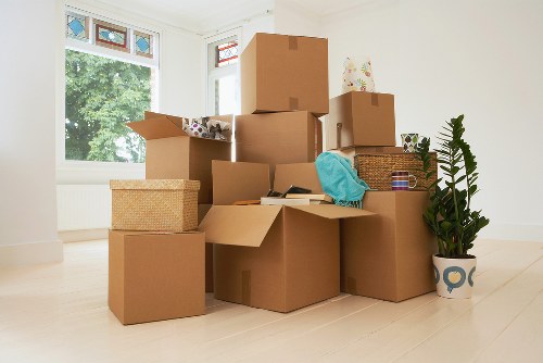Professional movers handling office equipment during a relocation