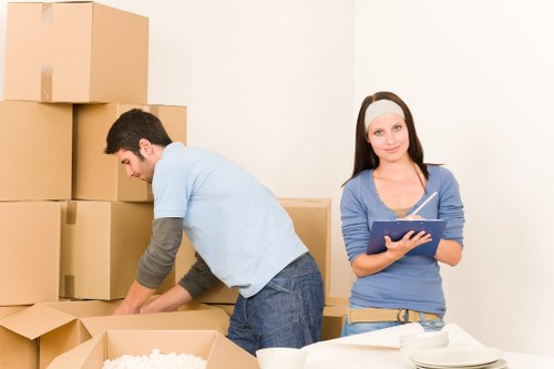 Safe moving practices with furniture protection and team coordination