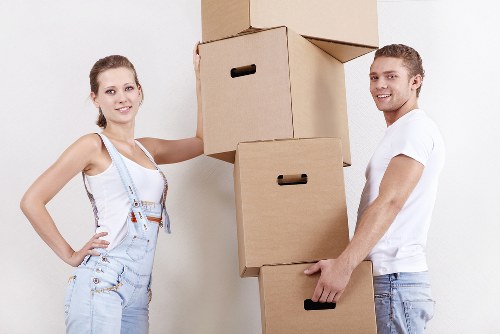 Professional movers loading boxes for a Balham flat move